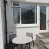 Photo 1: South facing front entrance 