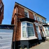 Photo 7: Front of house 