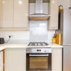 Photo 6: This is a kitchen