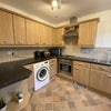 Photo 4: Lovely kitchen with plenty of cupboard space, a dishwasher, a washing machine and separate dryer.