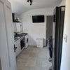 Photo 4: Brand new kitchen with tv