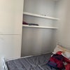 Photo 4: Bedroom with Single Bed, showing storage and shelves.