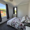 Photo 9: Bedroom 1: Double Bed, Mattress, Bedside Tables, Chest Drawers, 1.5 meter wide wardrobe