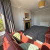 Photo 4: Lounge/Dining Room with original feature fireplace
