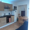Photo 4: Kitchen with sofa and sitting table