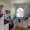 Photo 2: Kitchen with dishwasher, oven, stove, fridge/freezer