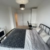 Photo 2: Bedroom with large wardrobe, extra storage, desk and chair