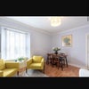 Photo 6: living room with a dining table perfect for a small gathering 