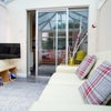 Photo 4: Bright Communal Lounge Leading to Garden