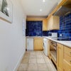Photo 7: Kitchen with Washer Dryer