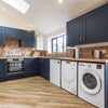 Photo 2: Kitchen dining area with dishwasher, tumble dryer and washing machine