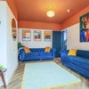 Photo 2: Living room with large smart TV