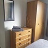 Photo 5: Wardrobe and drawers in room