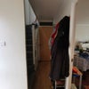 Photo 6: Downstairs hallway, leading to garage