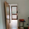 Photo 5: View from living room towards front door (kitchen to the left, stairs onnthe right)