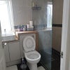Photo 2: Toilet and Shower