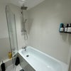 Photo 9: Bathtub + x 2 Showerhead