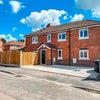 Photo 9: Front of house and parking