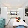 Photo 7: Communal Kitchen and Living Area