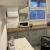 Photo 9: Kitchen - Table & Microwave