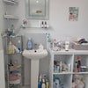 Photo 6: bathroom sink and storage