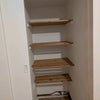 Photo 4: This is one of the 2 cupboards built into the room