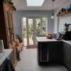 Photo 7: Kitchen with doors to patio