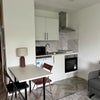 Photo 4: Kitchen, including microwave oven and portable 2-ring induction hob.