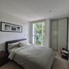 Photo 2: Large sized bedroom, set of drawers and more storage behind camera.