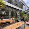 Photo 5: Bright and inviting balcony with comfy seating, a large table, and lush plants – ideal for relaxin