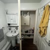 Photo 6: Shared bathroom - sink area and storage space