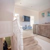 Photo 8: A view of the entryway up to the living room