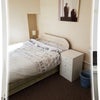 Photo 4: bed and bed side table