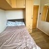 Photo 2: This is a small double bed and there is a storage under the bed as well.