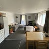 Photo 3: Shared kitchen and living space leading to balcony