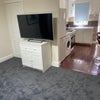 Photo 5: En-suite to left of tv 