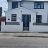 Photo 1: Front of property which is gated 