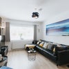 Photo 12: Living area with sofa's for movie nights