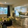Photo 6: Living area with sofa's for movie nights