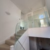 Photo 4: Corridor and stairs from Level 1 to level 2 of the house
