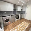 Photo 13: Kitchen galley area - open plan