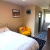 Photo 1: Bedroom area with view towards front door with kitchenette on the right