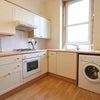 Photo 4: kitchen has since been repainted and several appliances updated