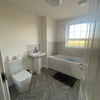 Photo 3:  Shared Bathroom - Clean and spacious shared bathroom between Room 1 and Room 2. A shower will be fi