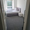 Photo 1: Bedroom with Double Bed and Clothes Rail (new bedding provided, workspace and/or wardrobe can be put