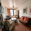 Photo 4: Communal living space (with a depressingly small fraction of available board games visible)