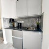 Photo 7: Fridge freezer, toaster, kettle, microwave and induction plug in hob provided.