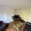 Photo 6: Lounge with 65" TV which is included