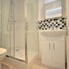 Photo 2: En suite bathroom of the available room