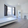 Photo 3: The living room ( no bed), now it has our (much cuter) furniture !